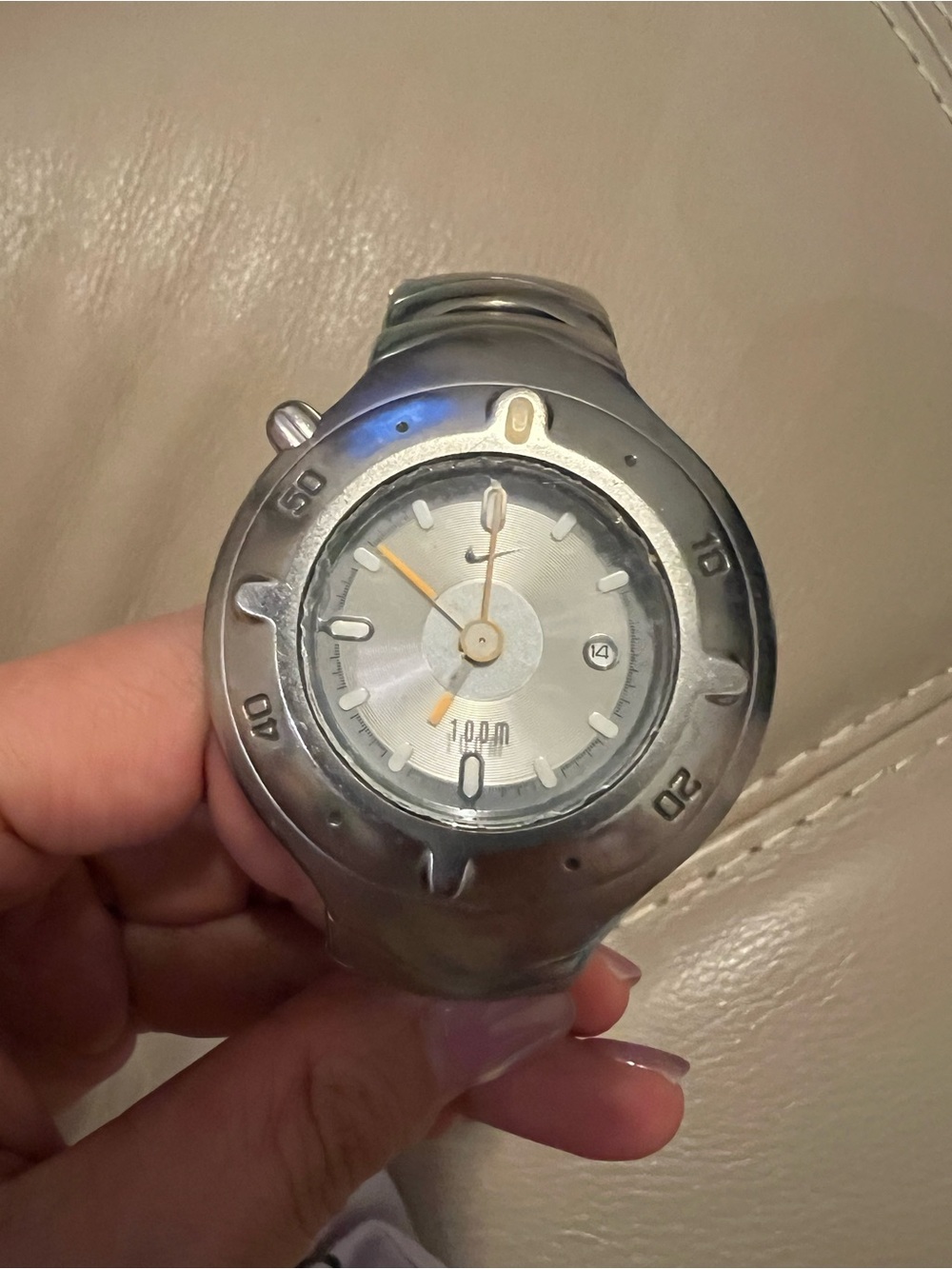 Nike Silver-Tone Watch with Orange Accents